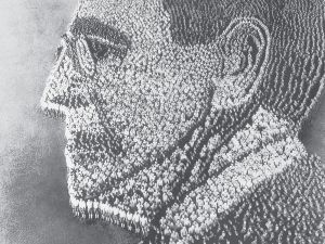 《致敬伍德罗·威尔逊》。1918年，美军谢尔曼兵营阅兵场，亚瑟·摩尔设计肖像并拍摄了这一场景；其中的21000名士兵由助手约翰·托马斯负责排列。（文化传播/FOTOE）
